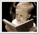 kid with glasses reading books